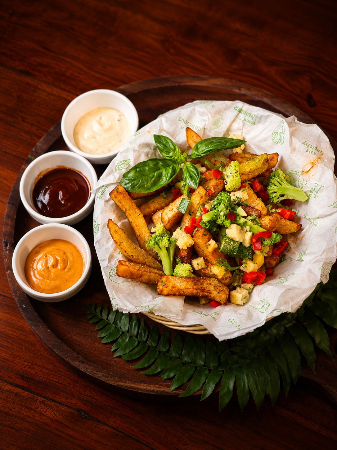 Loaded fries basket with dipping sauces